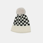 Checkered beanie with pom-pom on a white background