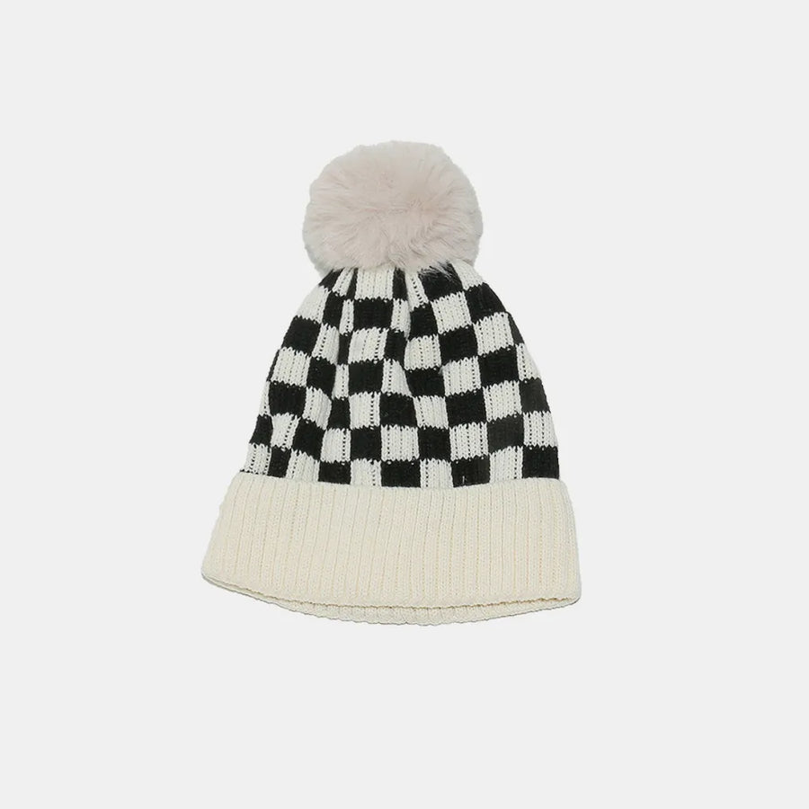 Checkered beanie with pom-pom on a white background