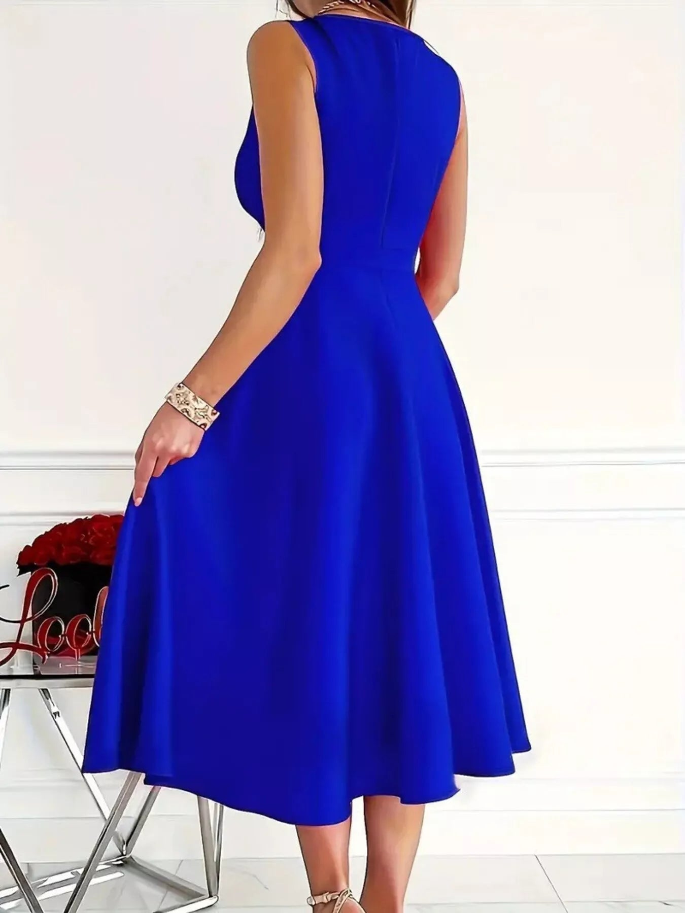 Blue dress worn by a person on a white background