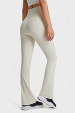Person wearing light-colored pants on a white background