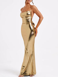 Gold strapless evening gown on a white background