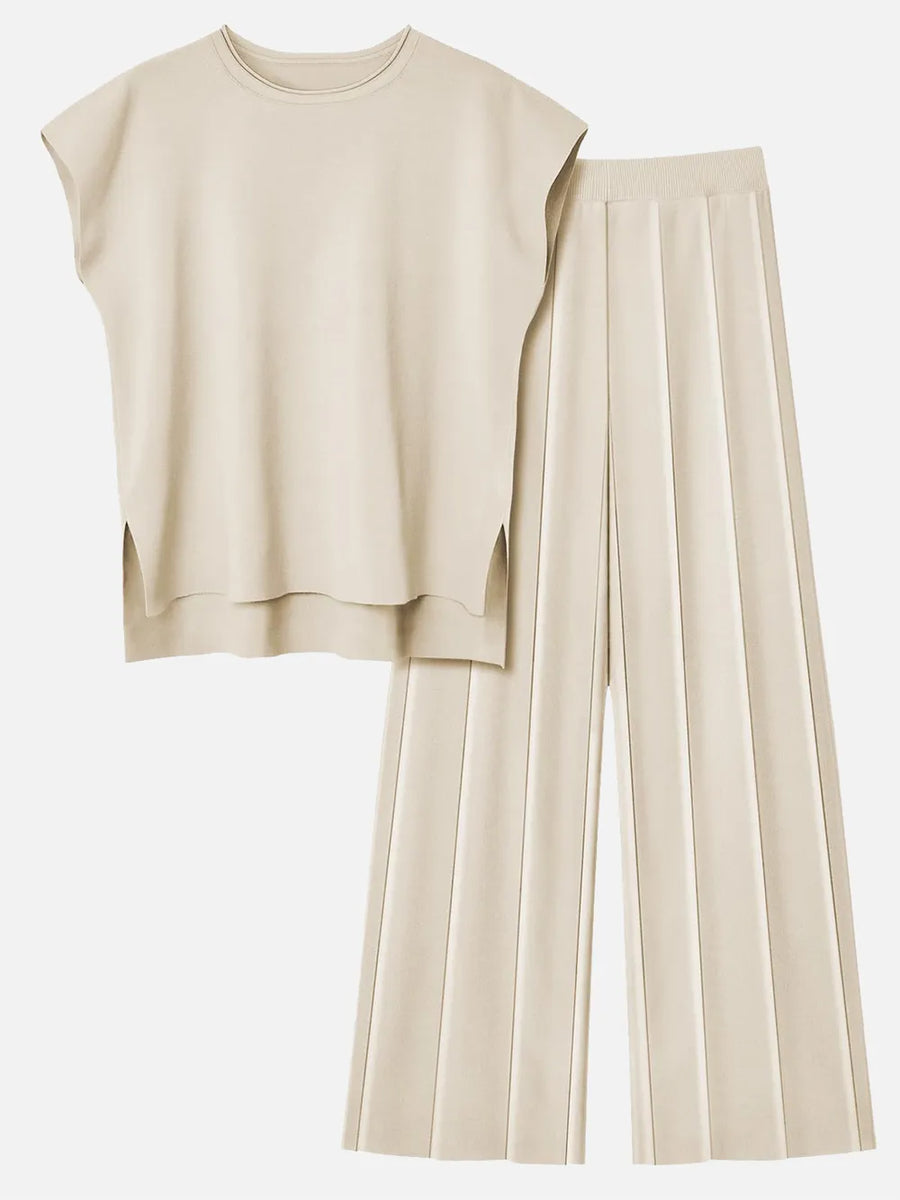 Beige sleeveless top and wide-leg pants on a white background
