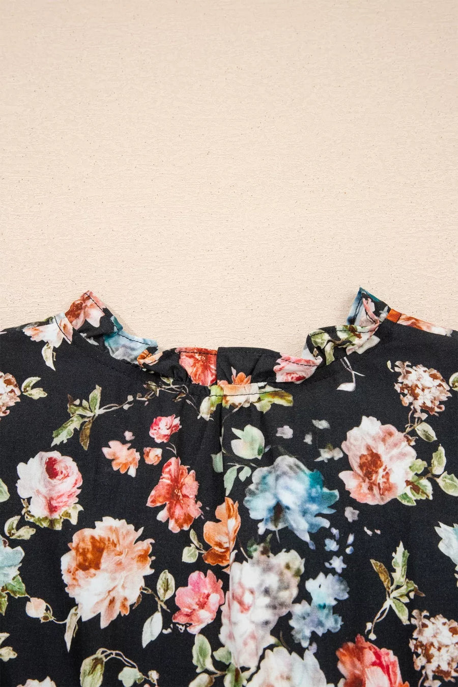 Floral patterned fabric on a beige background