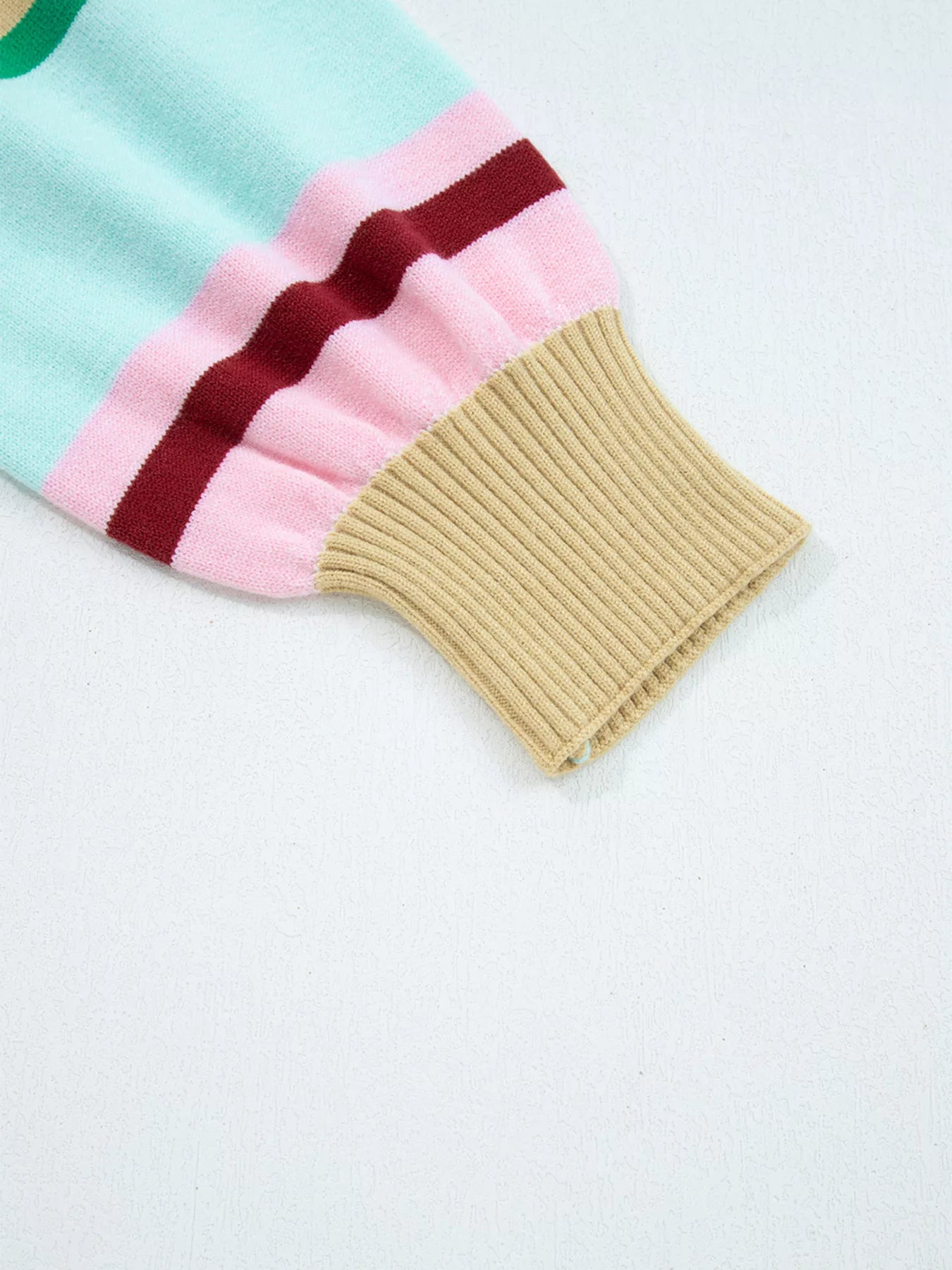 Colorful striped sock on a light gray background