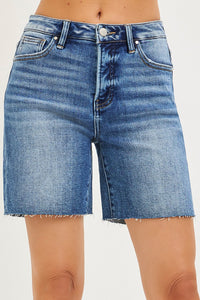 Blue denim shorts on a white background