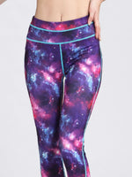 Galaxy-themed leggings with a white background