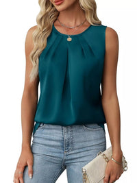 Woman wearing a teal sleeveless top and blue jeans on a white background