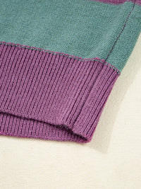 Close-up of a folded fabric with purple and teal edges on a white background