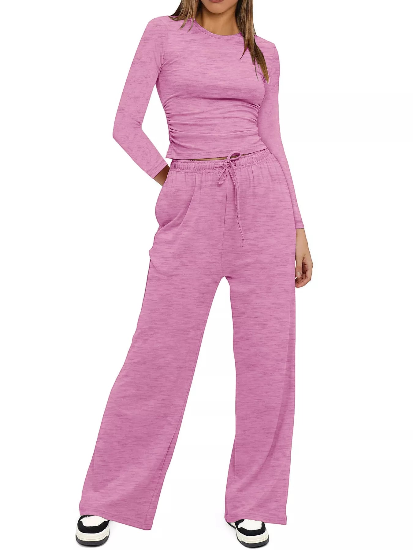 Pink long-sleeve top and wide-leg pants set on a white background