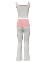 White tank top and light gray pants with pink waistband on a white background