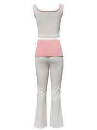 White tank top and light gray pants with pink waistband on a white background