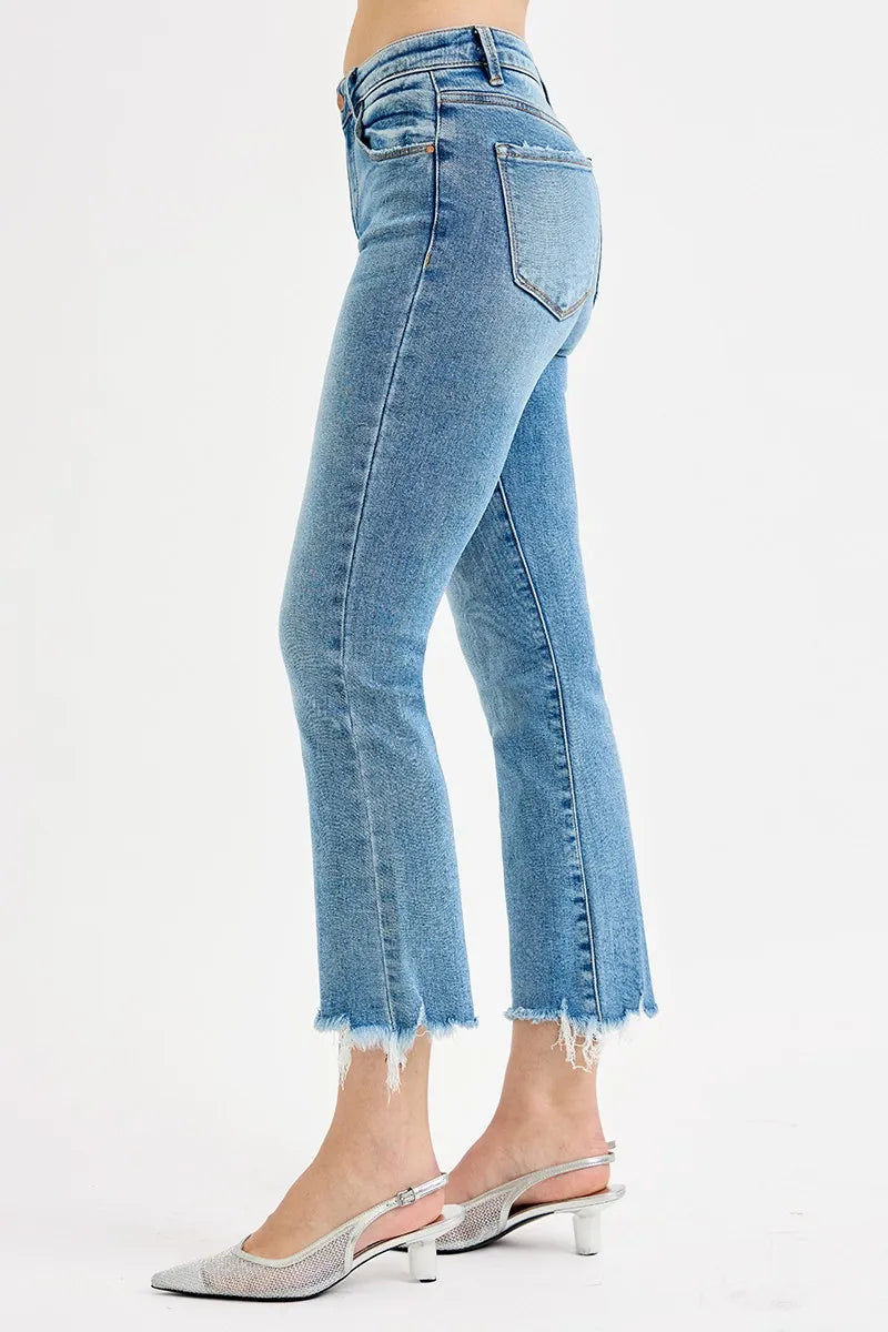 Light blue jeans worn by a person on a white background