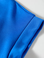 Close-up of a blue fabric with a plain background