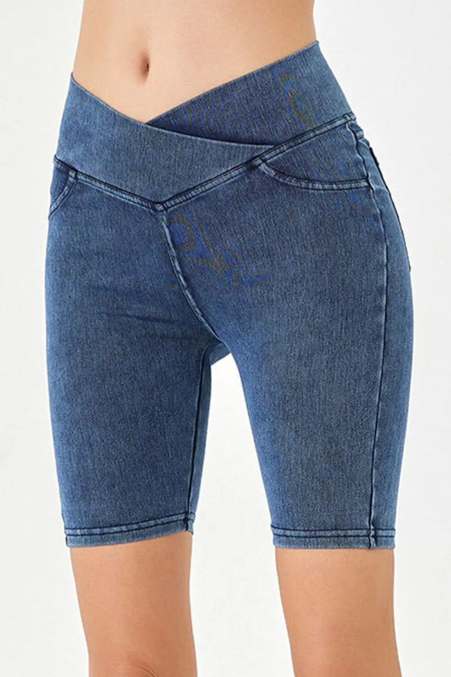 Blue denim shorts on a white background