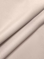 Close-up of beige fabric with a subtle texture
