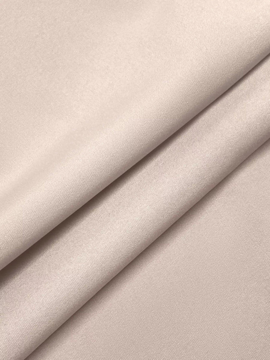 Close-up of beige fabric with a subtle texture