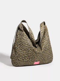 Leopard print bag with a pink tag on a white background