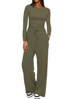 Woman wearing a green jumpsuit on a white background