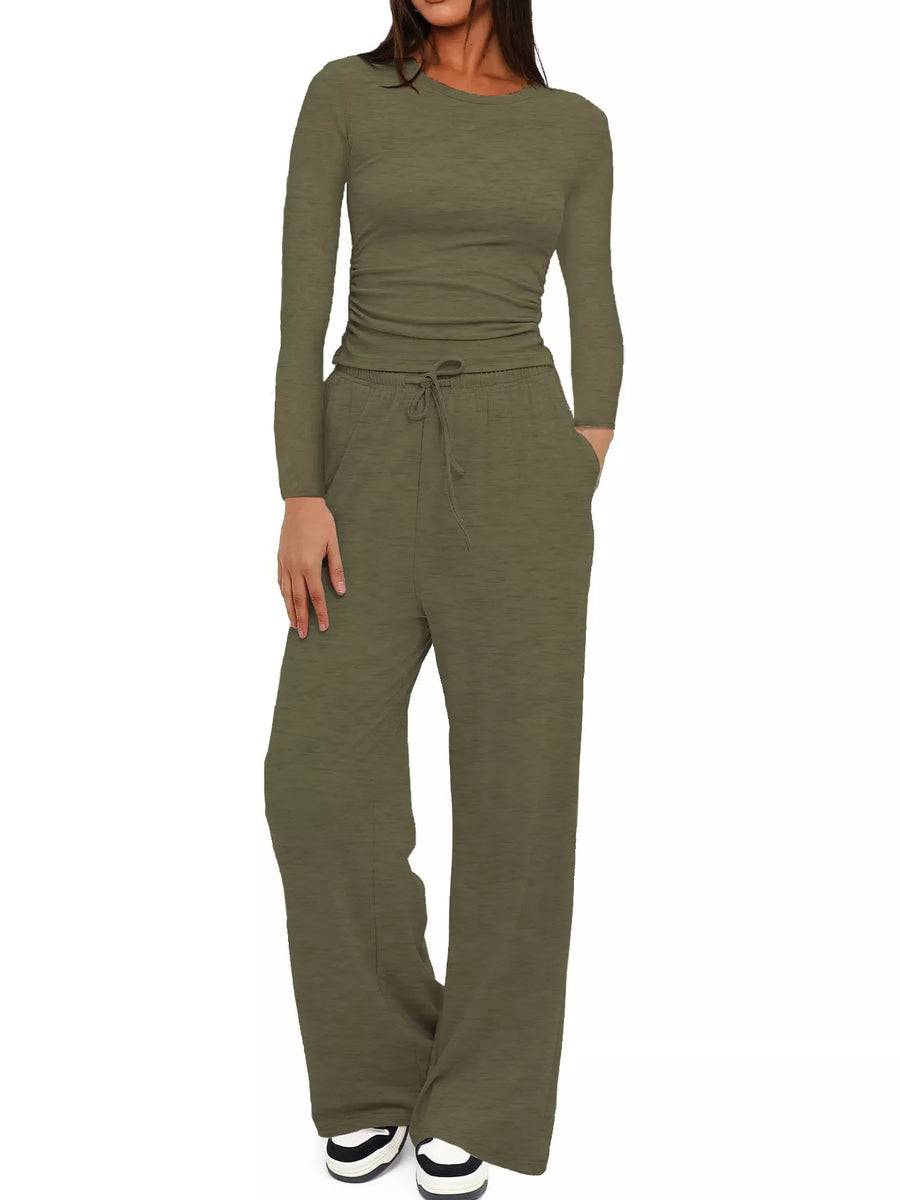 Woman wearing a green jumpsuit on a white background