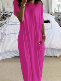 Person wearing a bright pink dress in a bedroom setting