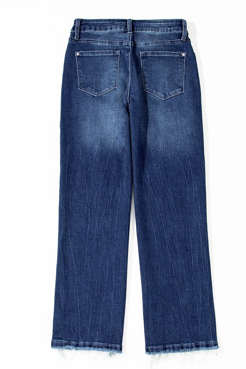 Back view of blue jeans on a white background