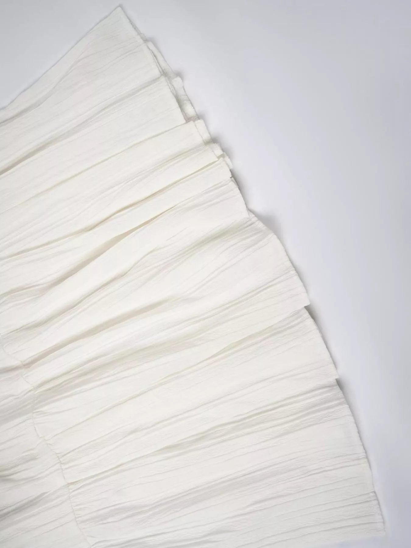 Stack of white paper sheets on a white background