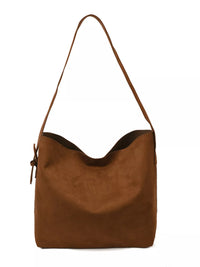 Brown leather handbag with a strap on a white background