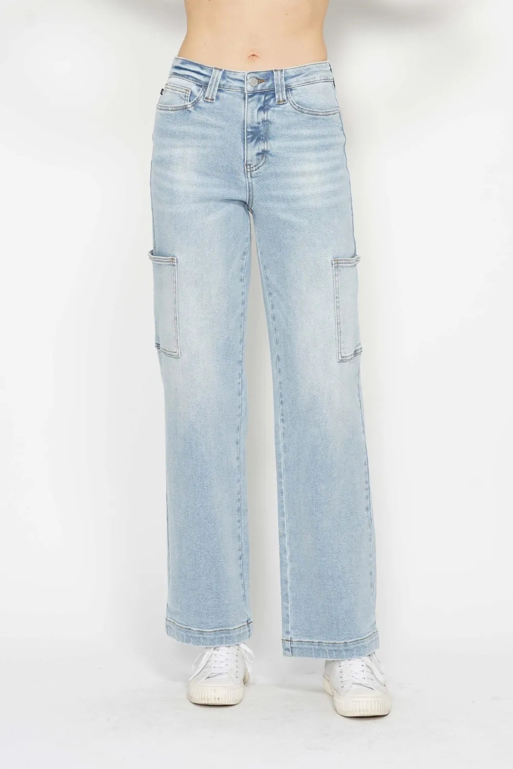 Light blue jeans worn by a person on a white background