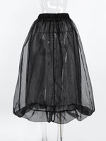 Black sheer skirt on a white background