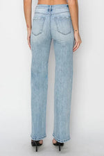 Light blue jeans worn by a person on a white background