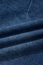 Close-up of blue denim fabric with visible texture