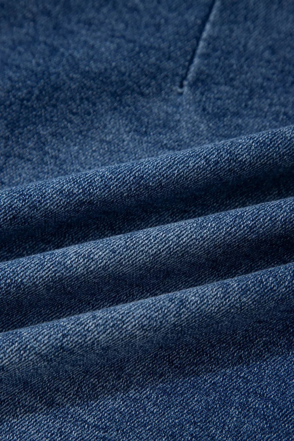 Close-up of blue denim fabric with visible texture