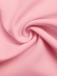 Close-up of pink fabric with a swirl pattern
