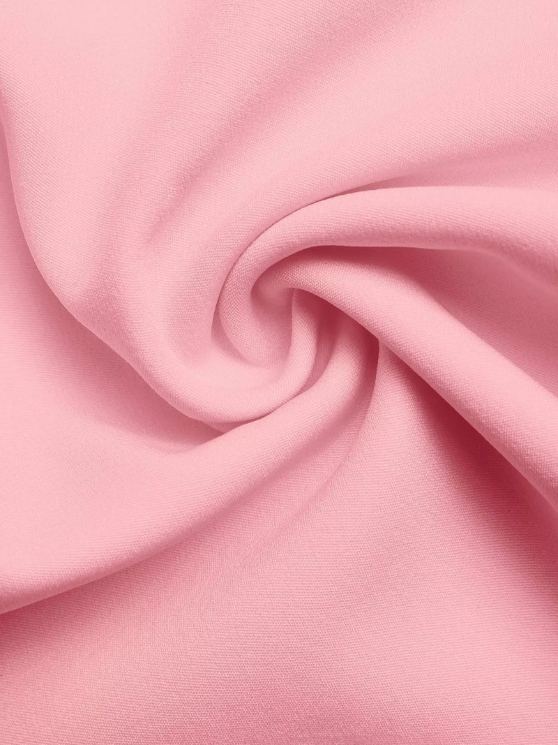 Close-up of pink fabric with a swirl pattern