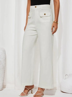 Person wearing white wide-leg pants with gold buttons on a white background