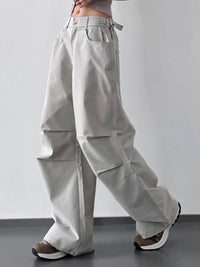 Light gray wide-leg pants worn by a person on a plain background