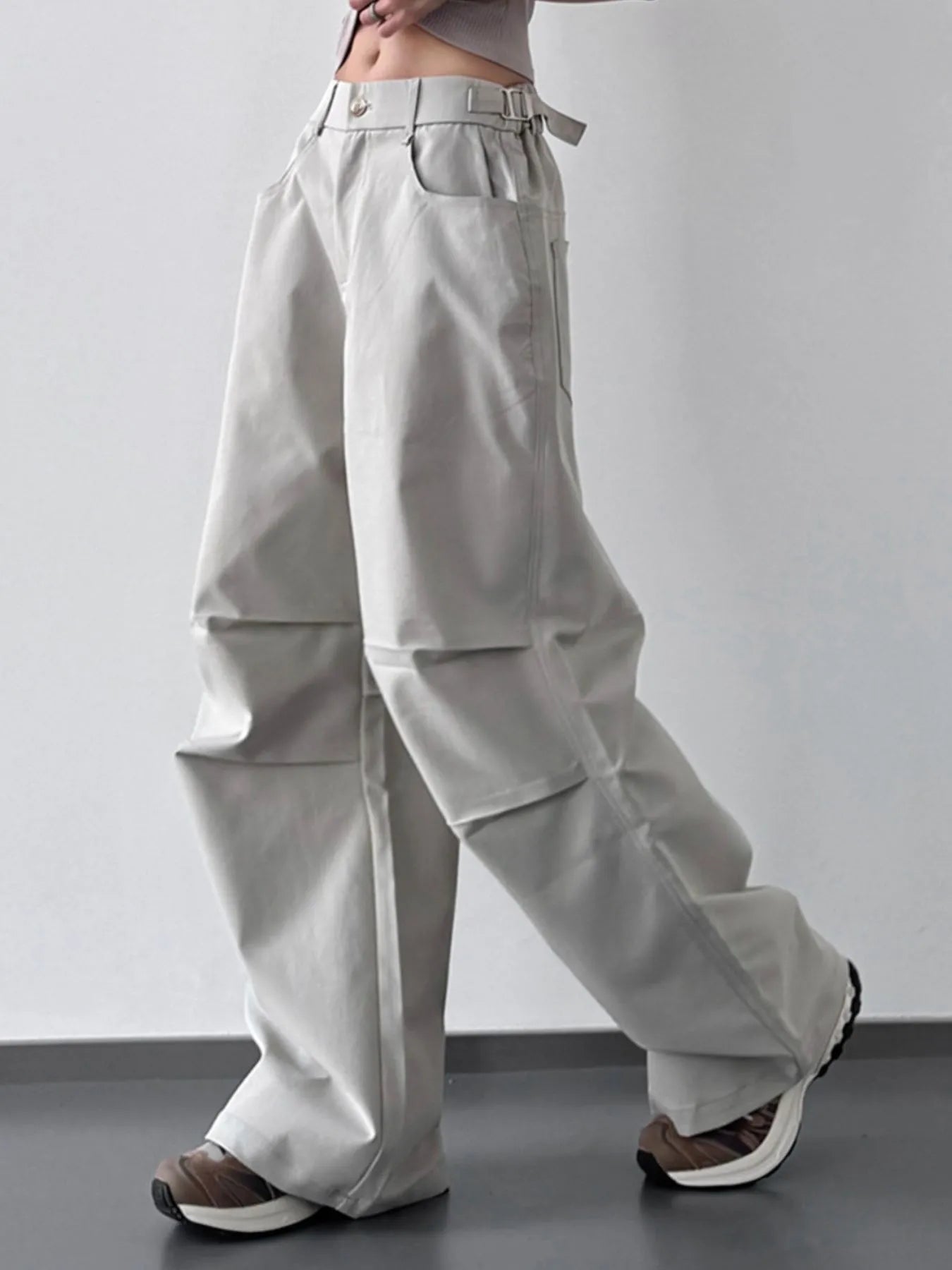 Light gray wide-leg pants worn by a person on a plain background