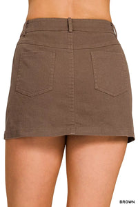 Brown skirt worn by a person on a white background