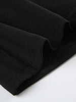 Close-up of a brown leather product with visible stitching on a white background