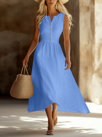 Woman wearing a blue dress with a straw bag in a sunlit setting