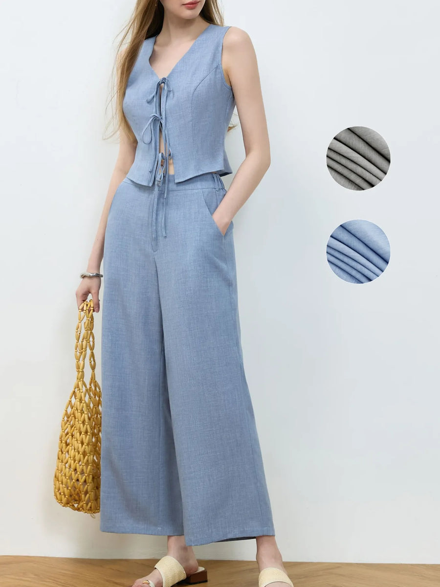 Woman wearing a blue jumpsuit with close-up color swatches on a white background