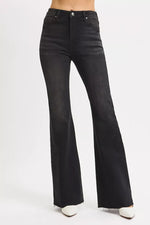 Black flared jeans on a white background