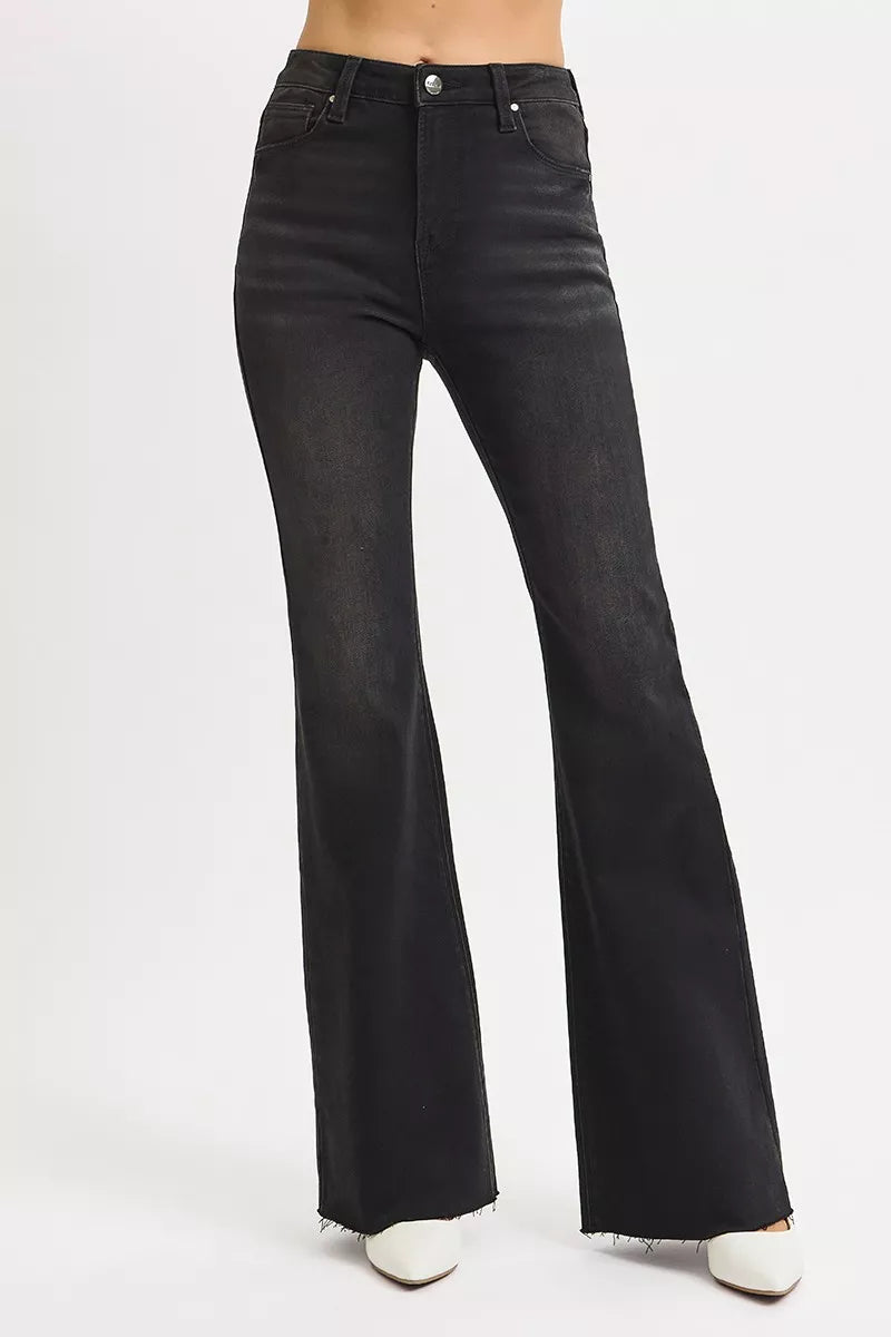 Black flared jeans on a white background