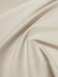 Close-up of beige fabric with folds
