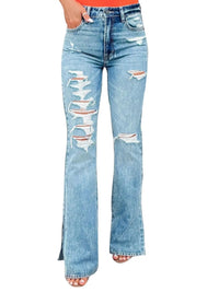 Distressed blue jeans on a white background