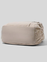 Beige pouch on a light gray background
