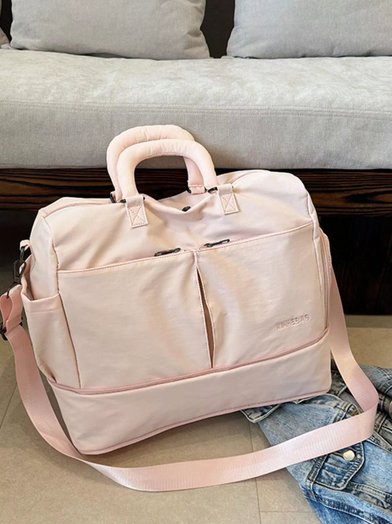 Pink travel bag on a couch with a cushioned seat