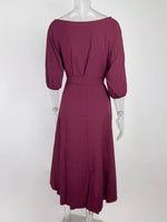 Mauve dress on a mannequin against a white background