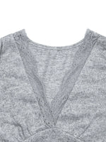 Gray sweater with lace trim on a white background