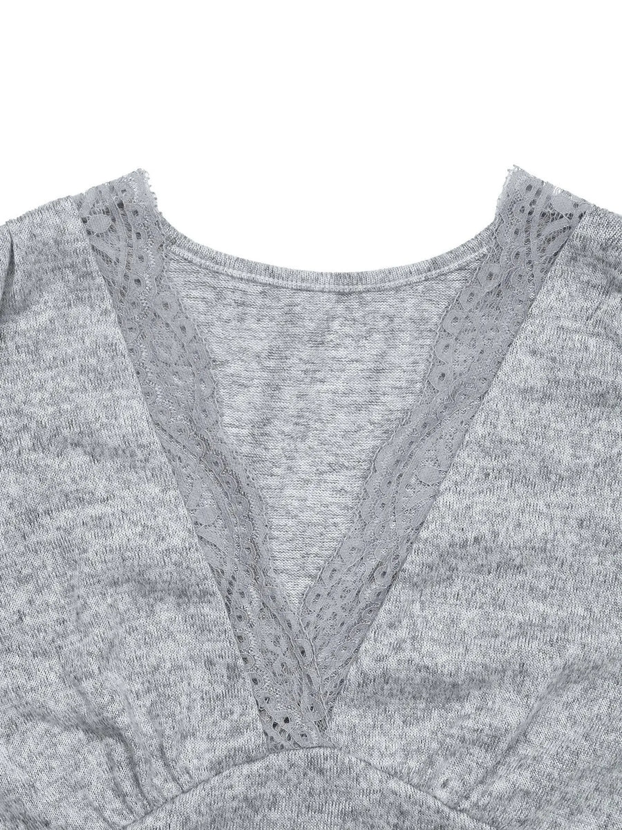Gray sweater with lace trim on a white background